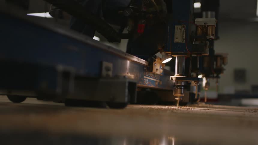 Closeup view of a machine cutting a material with precision