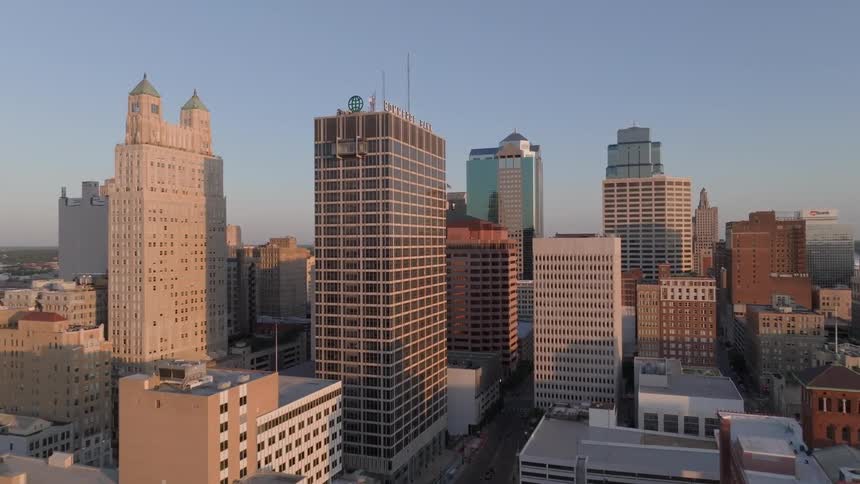 Aerial panorama of skyscrapers in a metropolis against a blue sky