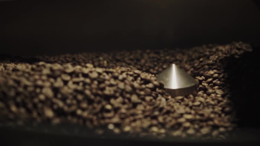 Coffee beans spin in a mixer