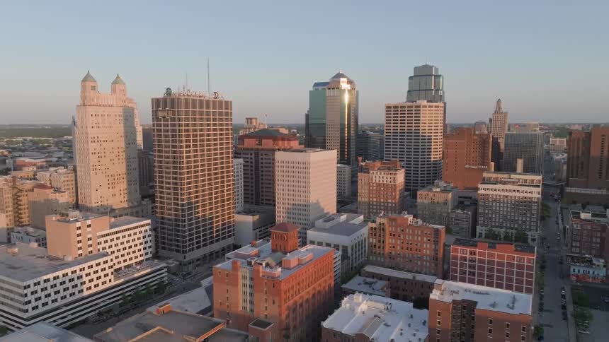 Large skyscrapers dominate a dense city downtown area