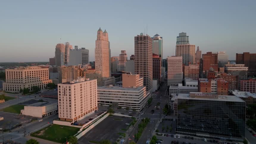 Traffic moves around a dense city downtown area