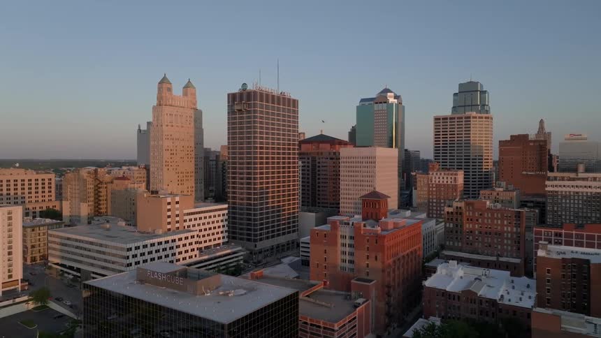 Aerial panorama of large modern buildings in a metropolis against a blue sky on a sunrise