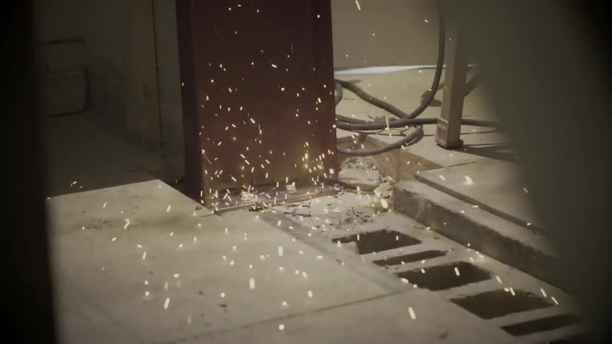 Sparks flying and landing on the floor inside