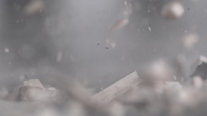 A hammer smashes down breaking everything apart