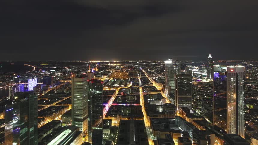 Panorama of a metropolis with large buildings illuminated at night