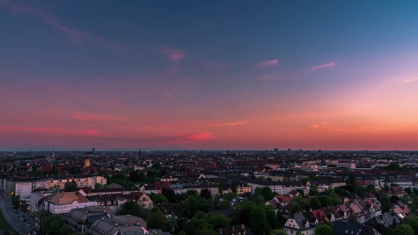 As dusk turns to night a city and its suburbs light up