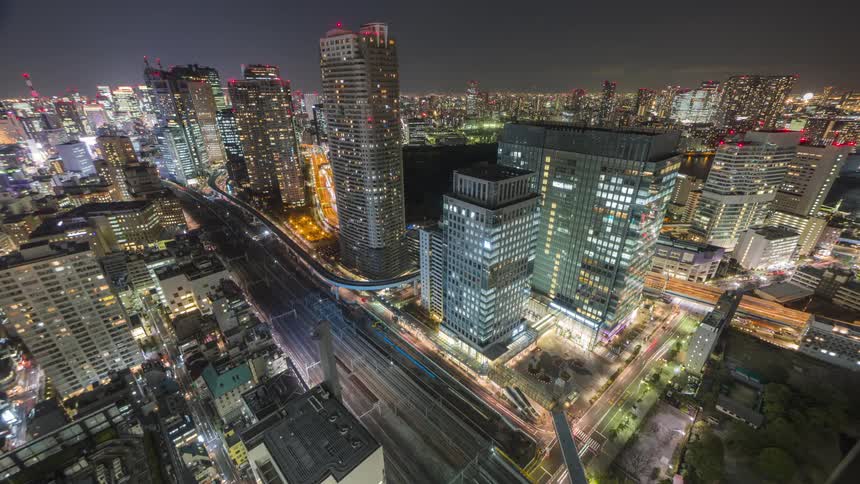 Panorama of a metropolis in time lapse at night with skyscrapers