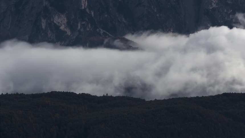Mountainous landscape with a sea of dense clouds