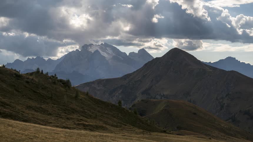Dark clouds float over a mountain range