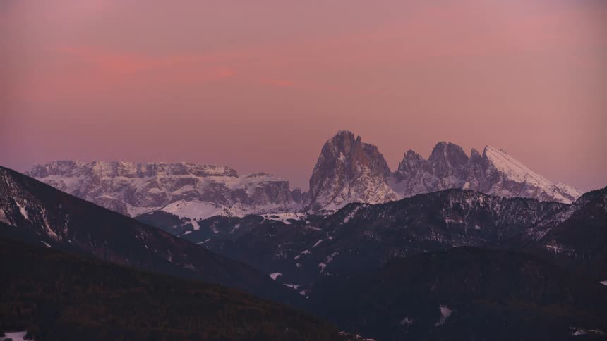 Mountains with snowcapped peaks and dusk