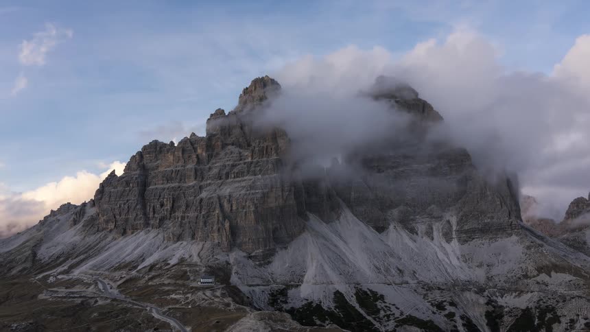 Huge clouds around a mountain peak