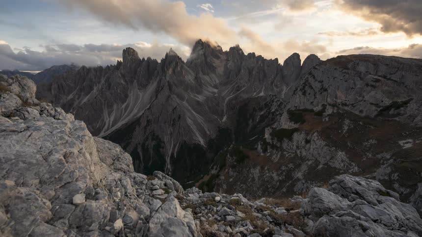 Clouds move over a stony mountain area