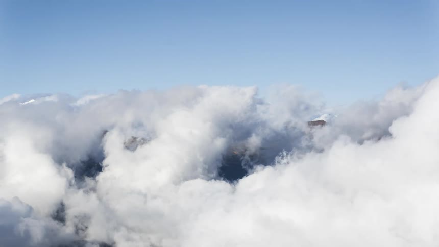 Landscape of a sea of clouds above mountain peaks
