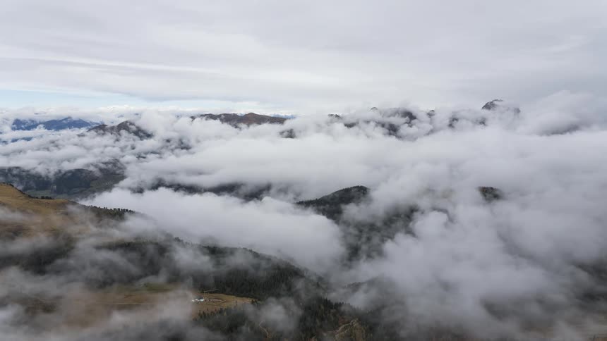 Mountainous landscape with low clouds