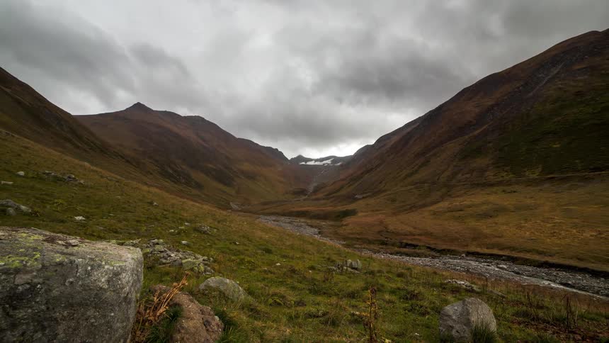 Mountains landscape on a day with cloudy and stormy clouds
