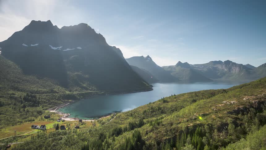 Reflecting above a mountain and at the edge of a lake