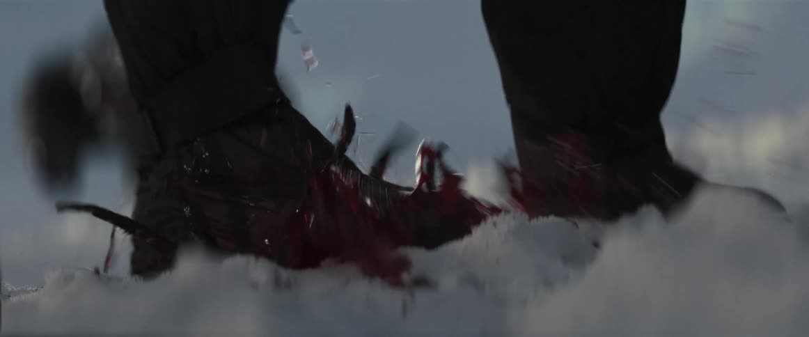 A boot squashing a tentacled creature splashing blood over a snowy landscape