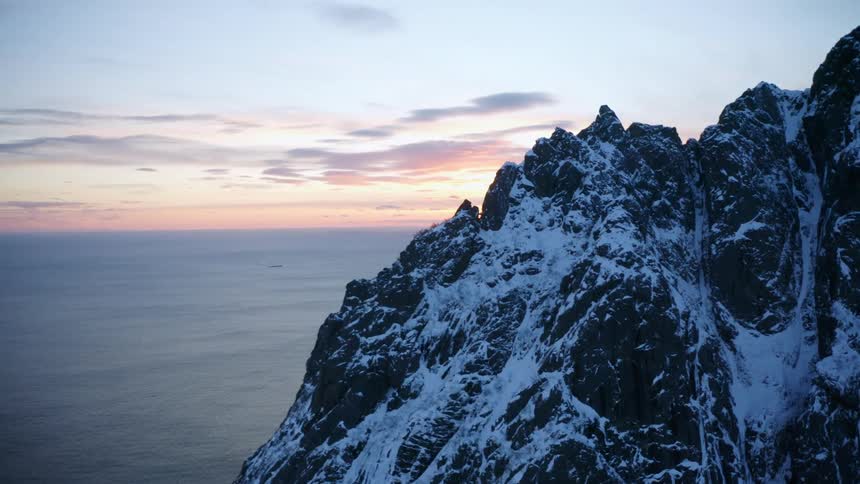 Aerial landscape of seaside mountains against the sky with sunrise from the horizon