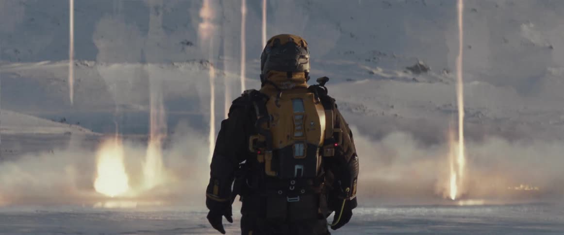 Person from behind wearing a suit and in the background lasers that hit the ground