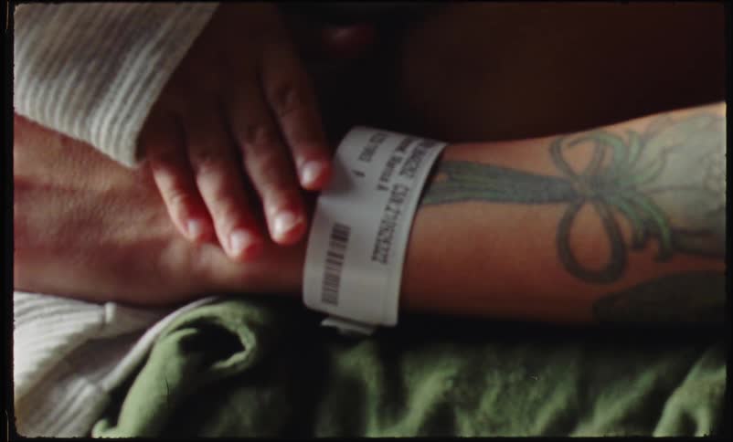 Two people are hugging in the hospital