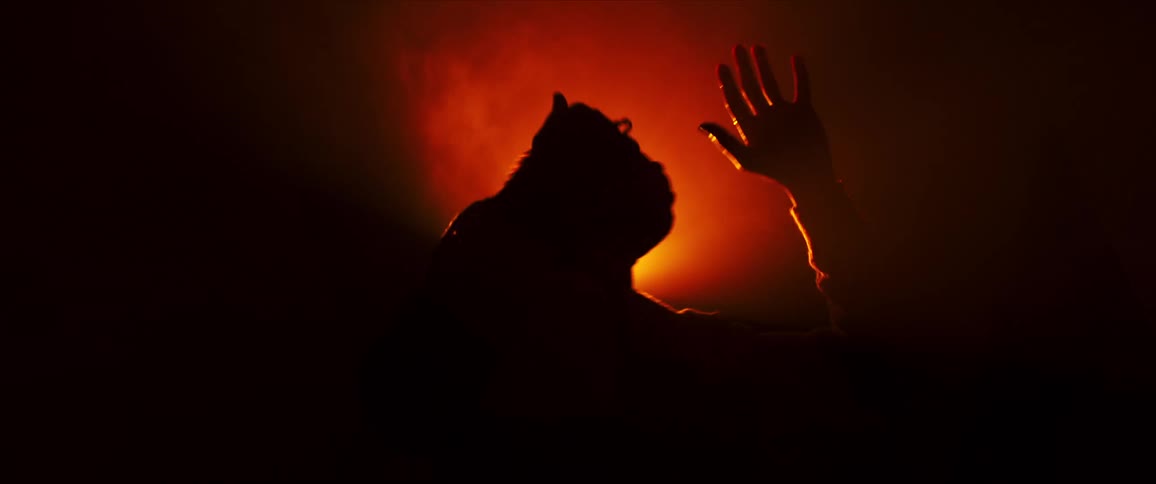 A man is dancing by himself outdoors during the night time