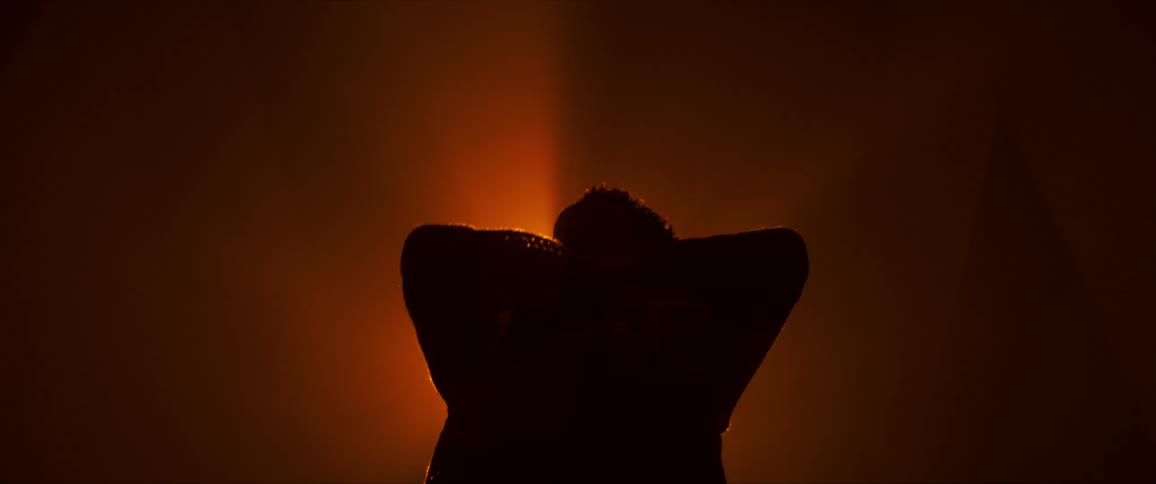 A black dancer in silhouette lit by a backlight