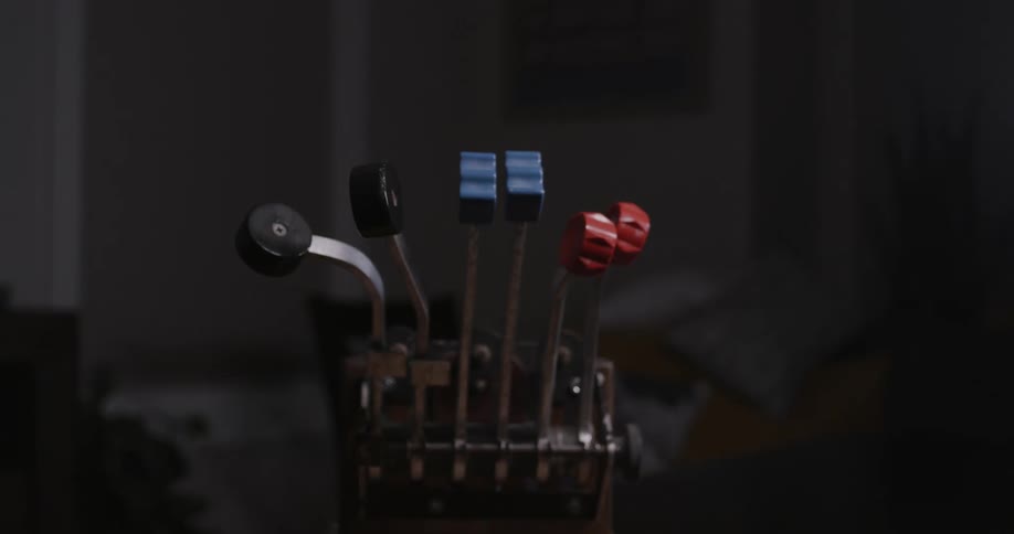 Close up of the controls of an aircraft isolated in a dimly lit room