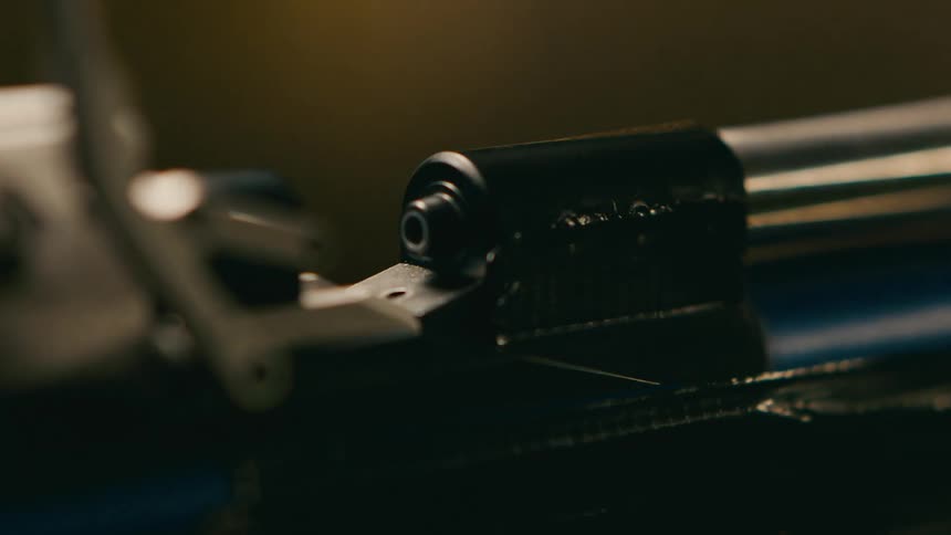 A person loads ammunition in the rifle