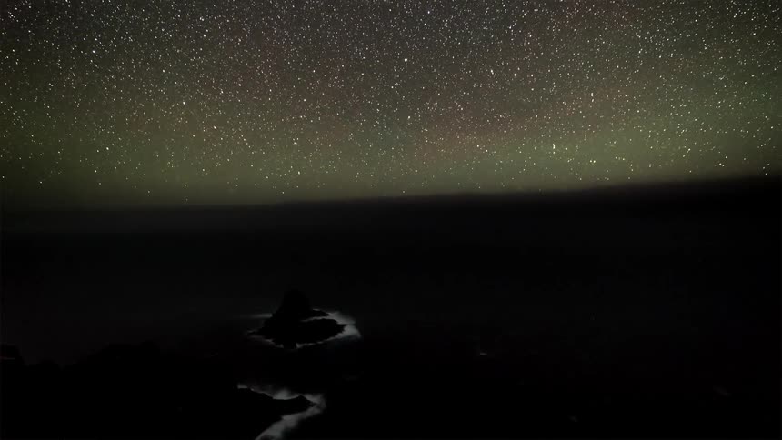 Starry sky with sea of clouds passing by