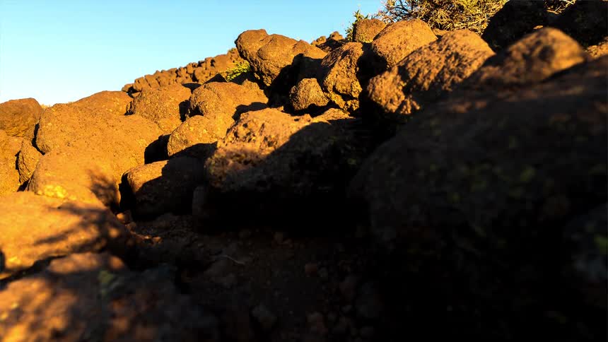 Time lapse of sunset and night falling over a rugged mountainous landscape