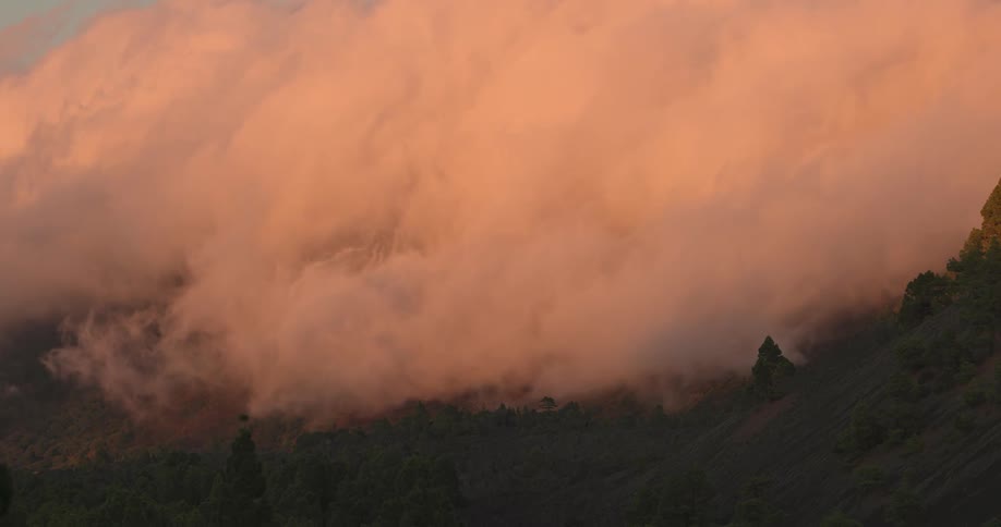 Heavy clouds touch the mountain