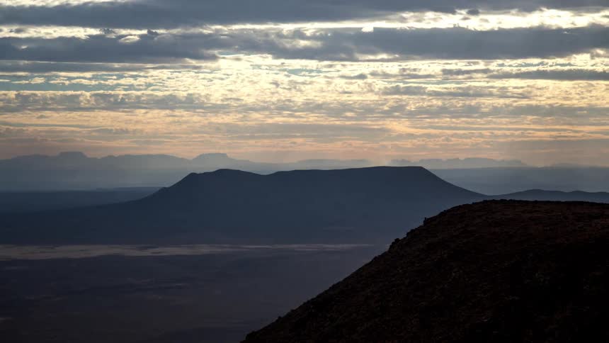 Canyon landscape against a cloudy sky and dusk