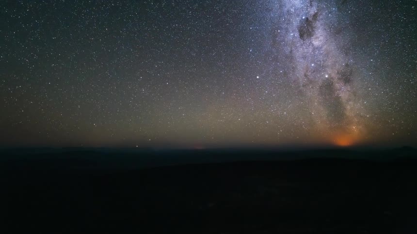 The milky way emerges as the sun sets