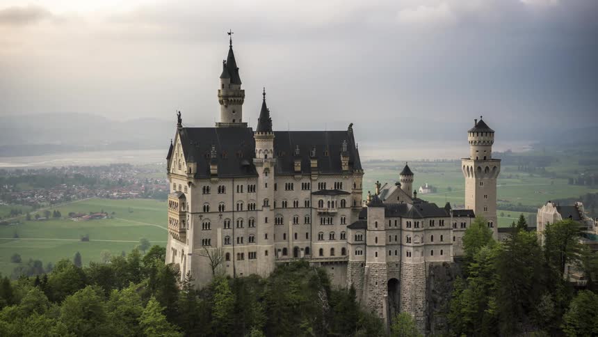 A large castle is on the mountain top