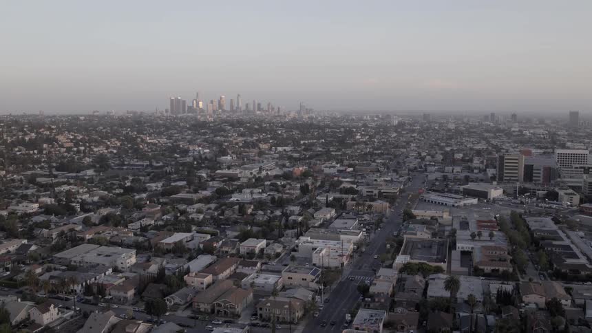 A wide view of a big city with tall skyscrapers in the distance