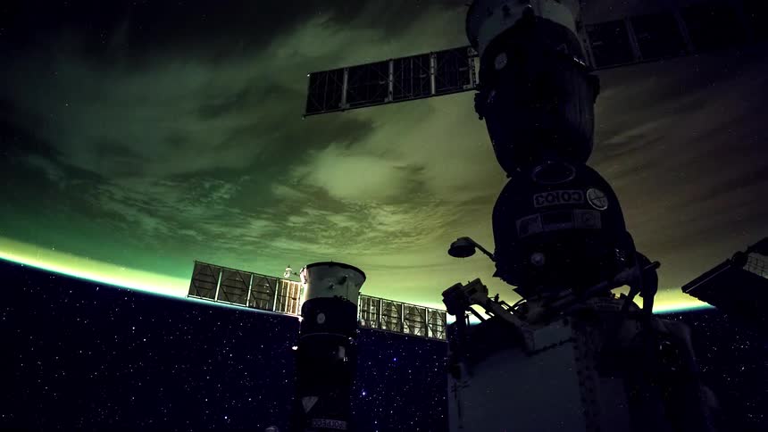 Soyuz spacecrafts docked at the international space station overlooking the earth
