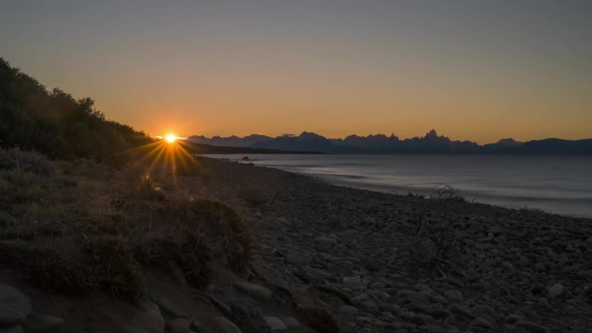 Golden sunset over a stony beach
