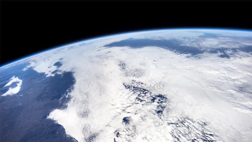 Orbiting space station moves from the day side to the night side of the earth