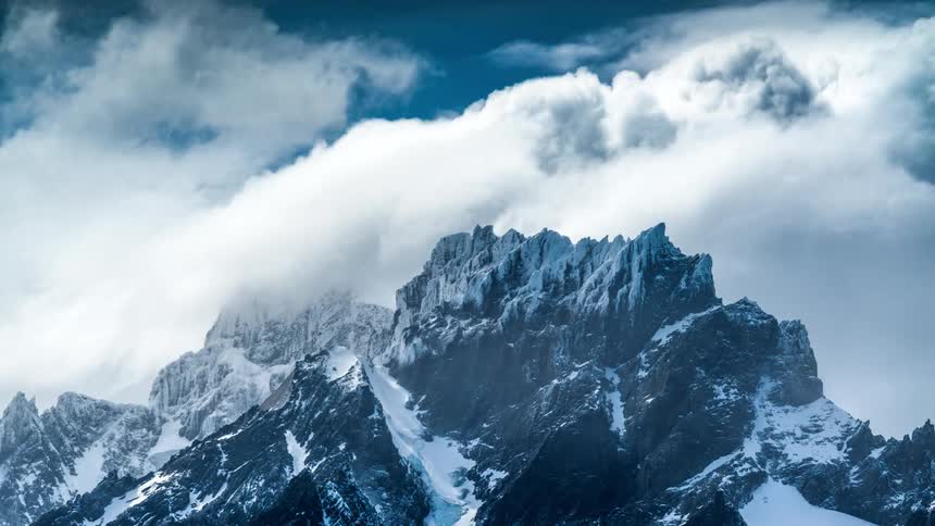 Time lapse of clouds moving above the mountain tops