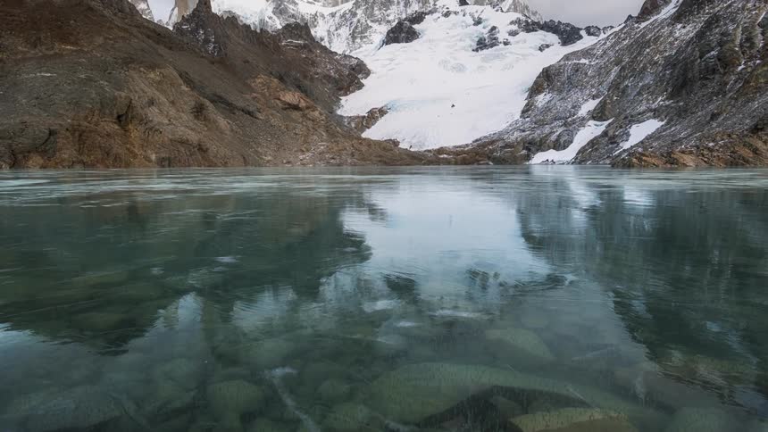 The water on the mountain is frozen