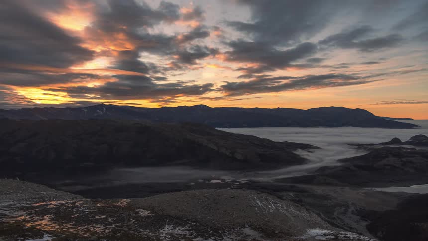 Mountain landscape with low clouds on a cloudy day at dawn