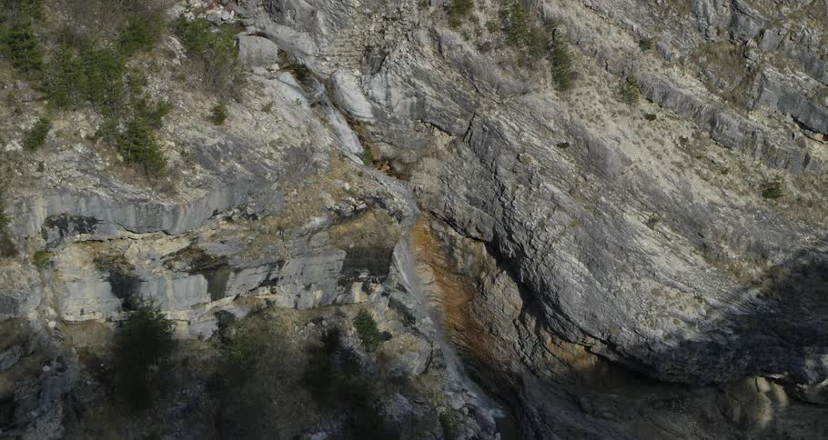 A stream is flowing downwards from the mountains