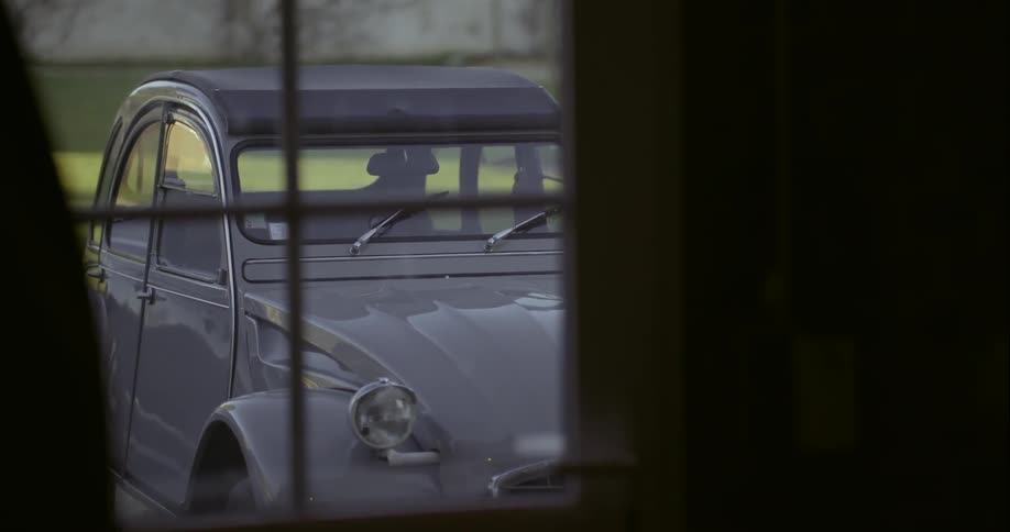 View of a modern volkswagen as seen through the window of a house