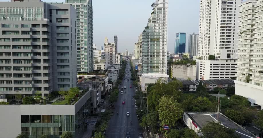 Aerial view following traffic through a large city