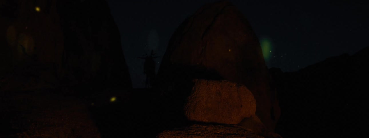 shiloutte of a wendigo near some rocks at night with reflection of a campfire