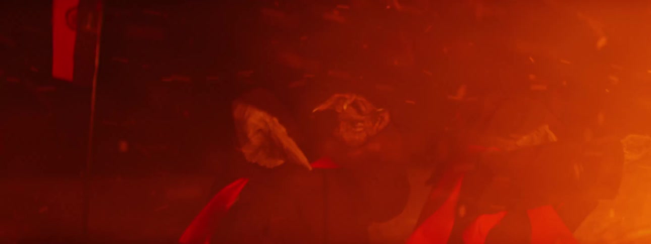 Two hideously alien looking creatures being rocked with hot burning sparks