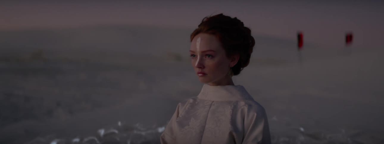 A artificially created woman with a white stripe on her face standing in water