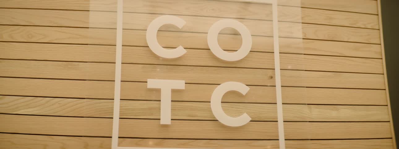 A sign is hanging on the wall