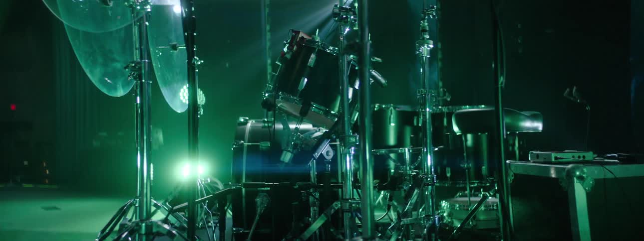A drum kit assembled on a theater stage
