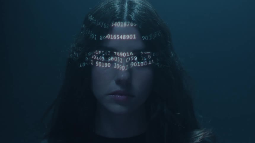 Number code appearing on a young womans face